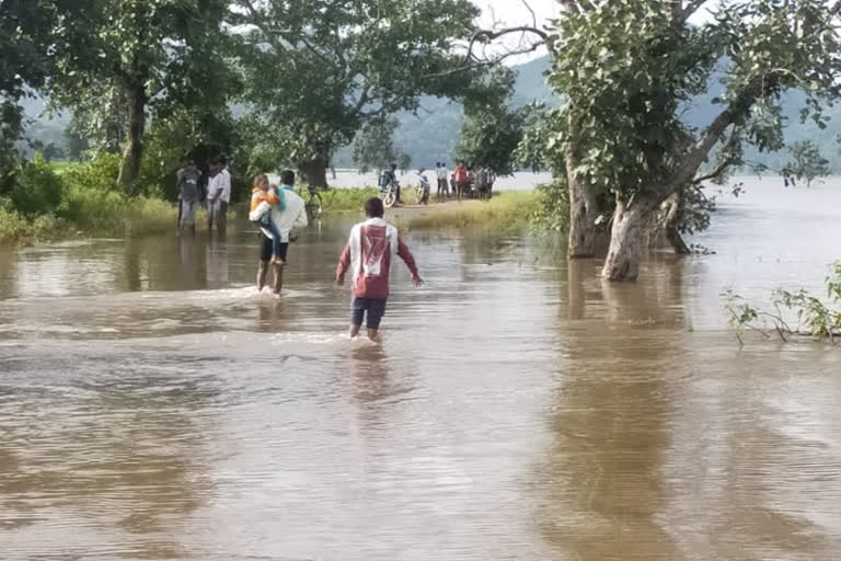 Villagers crossing the road