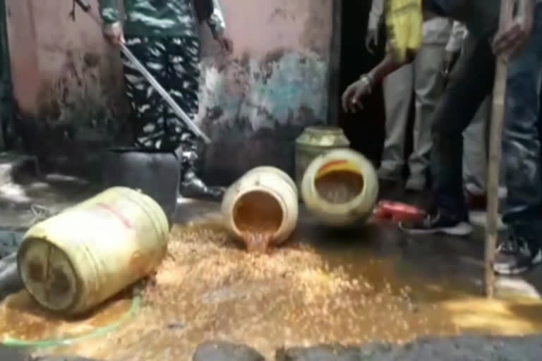 police raids and destroyed liquor kilns in dhanbad