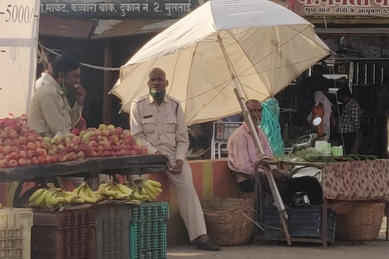 Policemen doing duty by removing masks