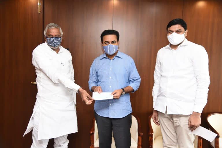 Gift a smile: MLA Divakar Rao handed over the check to Minister KTR