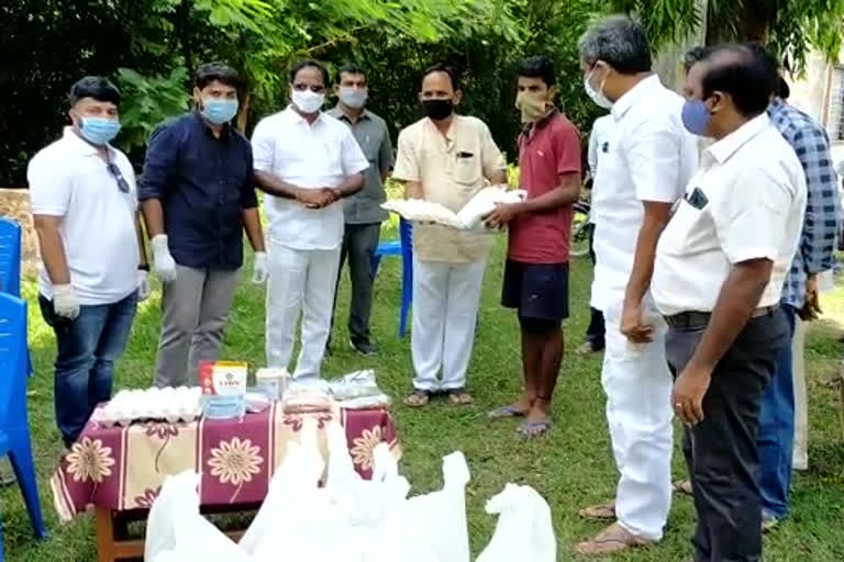 corona health kits distribution by devarapalli mla in viskaha district