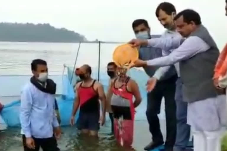 Rural Development Minister Virendra Kanwar casts silver fish in Govind Sagar Lake