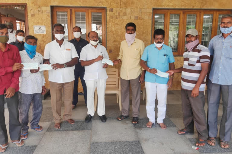 mla dharma reddy distributed cheques to corn farmers in warangal rural district