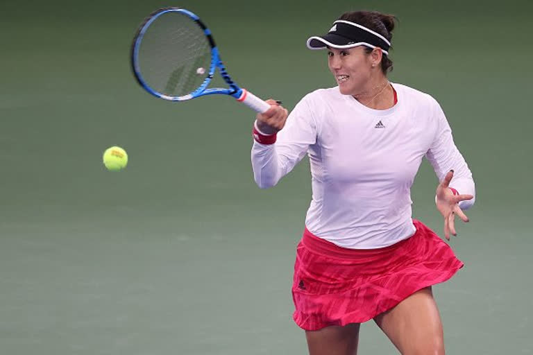 Muguruza shakes off rust to reach US Open second round