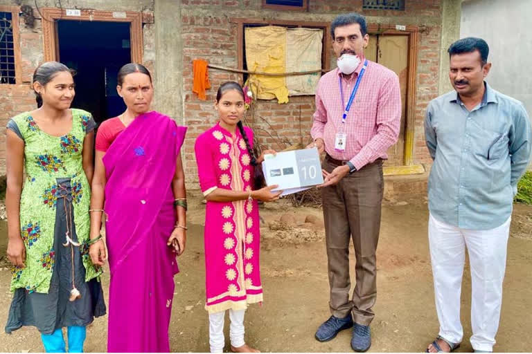 Vishnu Organisations Chairman Distributes Tabs for poor students