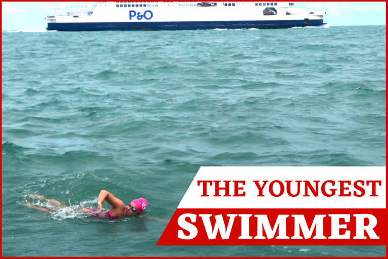 In this photo provided by Darcie DeBlois-Rivard, long distance swimmer Vera Rivard, 16, of Springfield, N.H. (below) swims the English Channel between Dover, England and Calais, France, as a channel ferry sails by (above), on Tuesday.