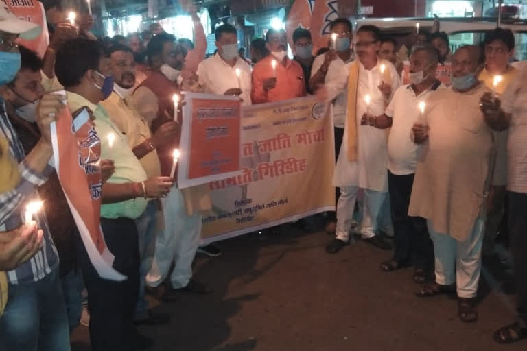 bjp takes out candle march in giridih