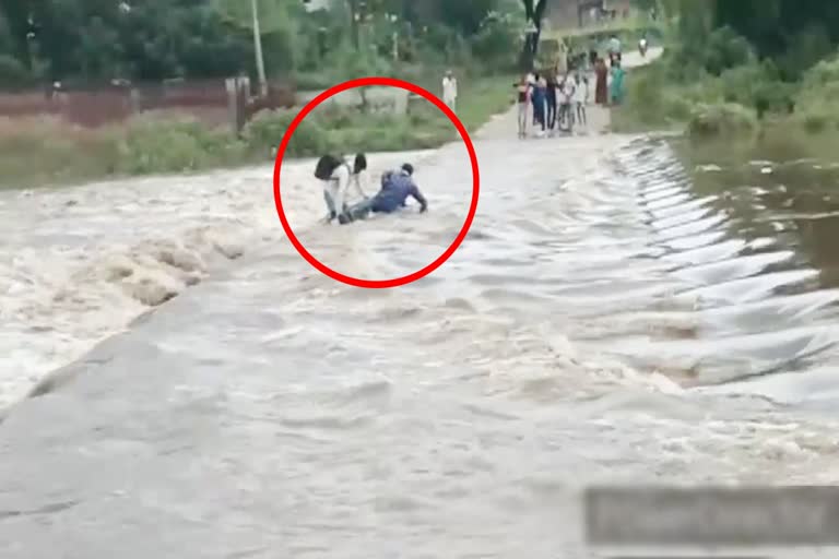 A young man drifting in a strong current