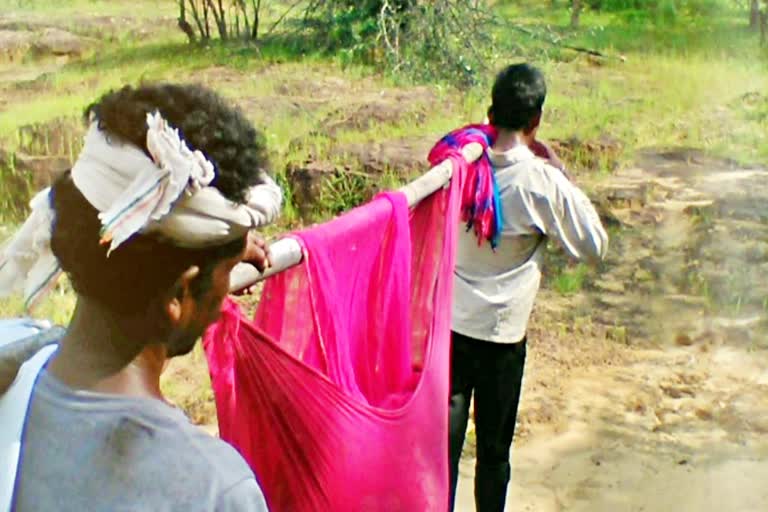 Villagers carrying maternity in bag