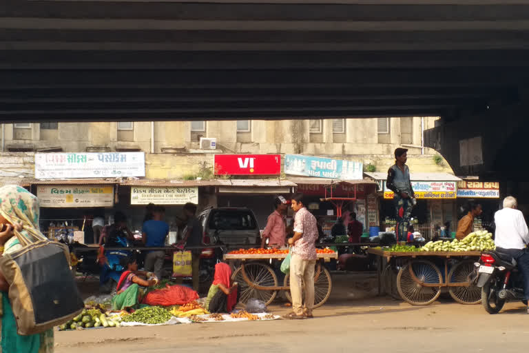 Vegetable sellers selling masked vegetables in Jamalpur vegetable market