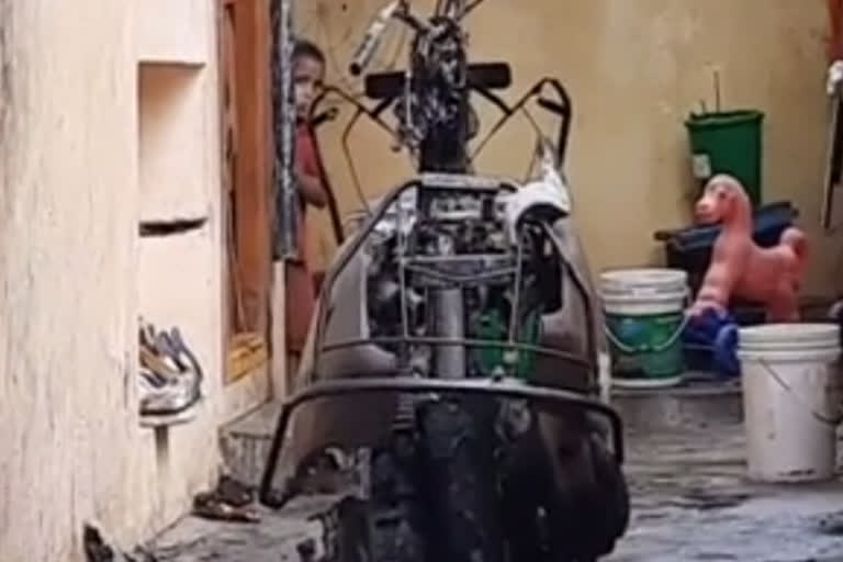 Two-wheeler burnt by lightning in jagityala