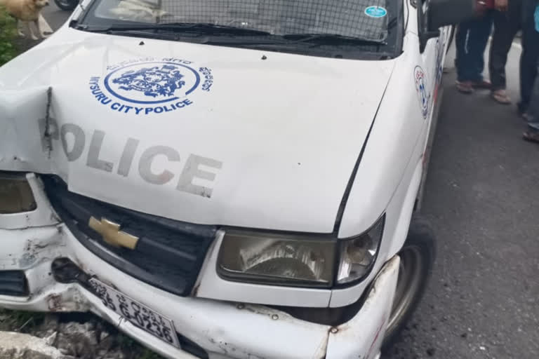 A police jeep colliding with a power pole