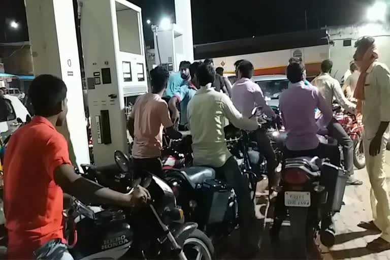 crowd of people in petrol pumps