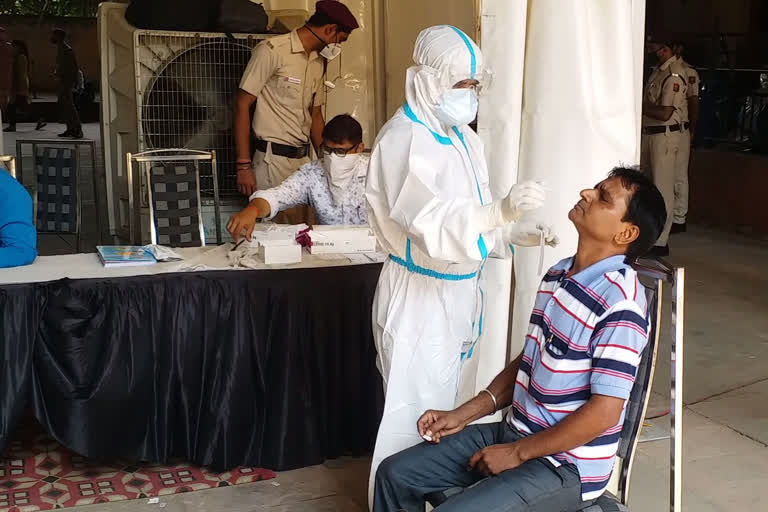 rapid corona testing of passengers at shadipur metro station in delhi