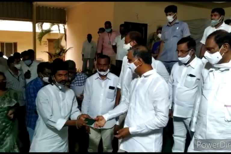 minister harishrao distributed pass books in medak district