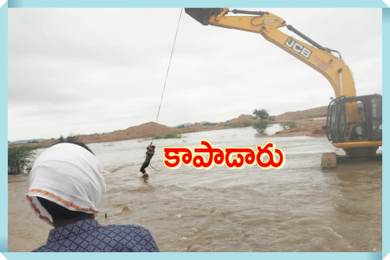 Locals and authorities rescue drivers stranded in the manjira river at kamareddy district