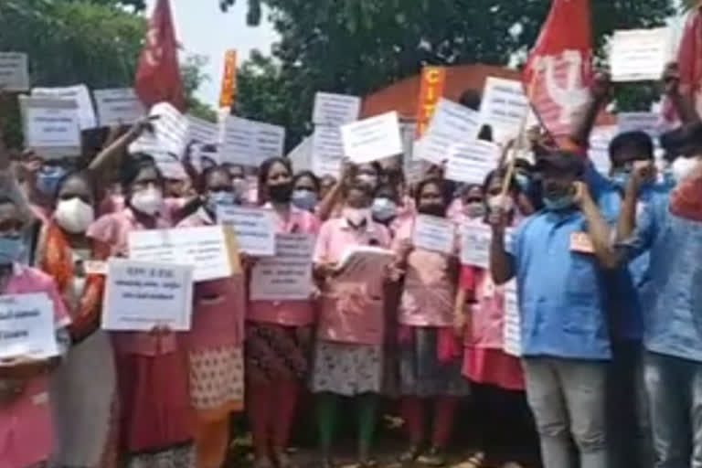 health workers protest at gandhi statue