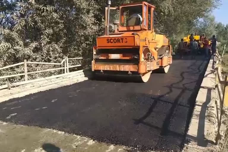 macadamization work begins on the mazbog bridge in sopore