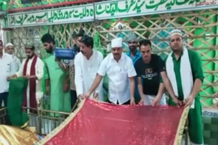 bsp candidate covers shrine with sheet in amroha uttar pradesh