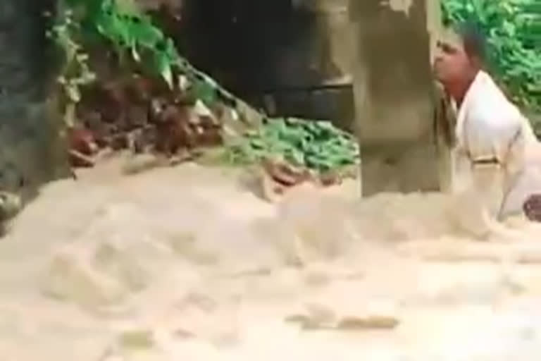 young man trapped in the flood at west godavari