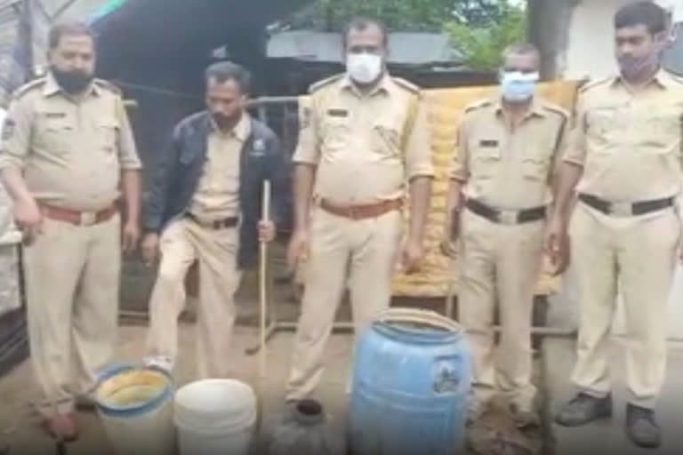 excise police attack on illegal liquor preparation centers in kollapoor