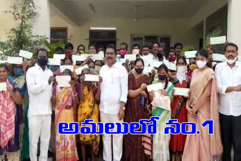 cheques distribution in karimnagar district