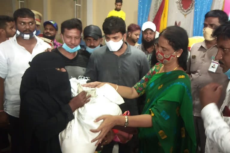 minister sabitha indra reddy distributed government help to flood effected people