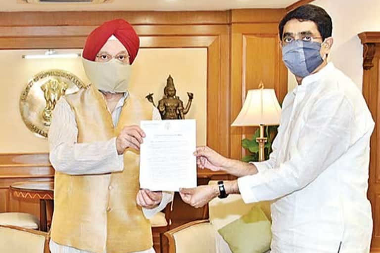 Union Minister Bugna Rajendranath Reddy presents petition to Union Minister Hardeep Singh Puri