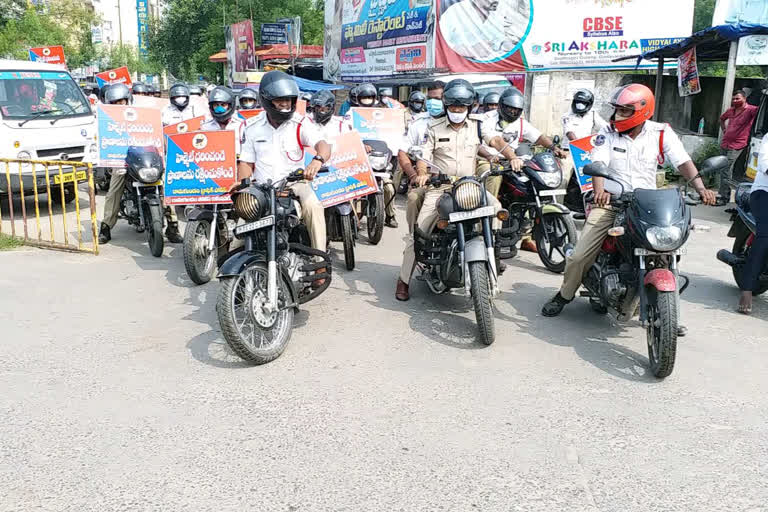 bike rally on helment importance awareness  at godavarikhani