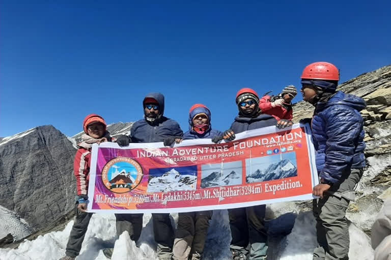 tricolor flag on Mount Friendship Peak