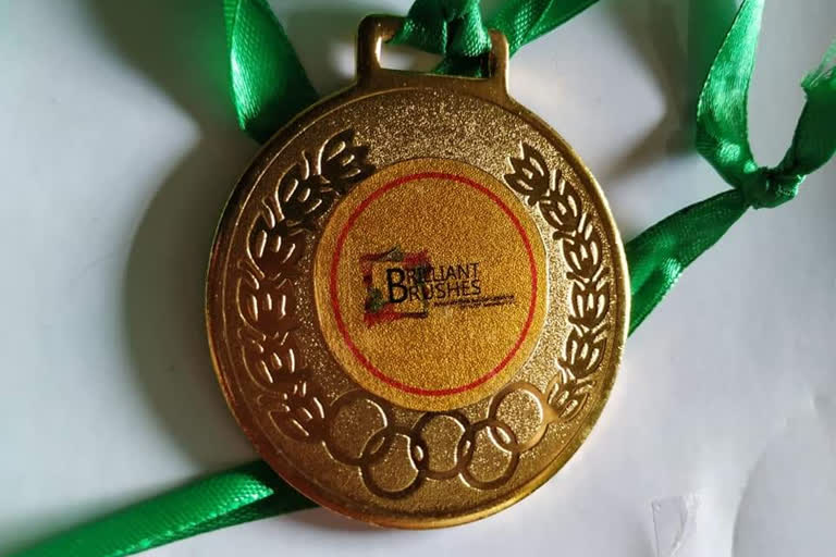 Golden medal got by Artist Devabrat Mahanta in Moran