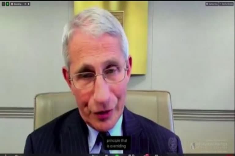 Life is likely to get back to normal by the end of next year, says Fauci
