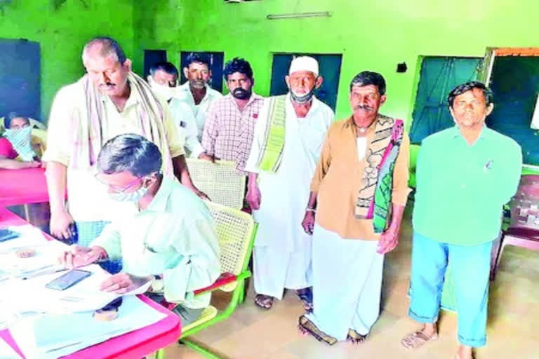 farmers noting crop details