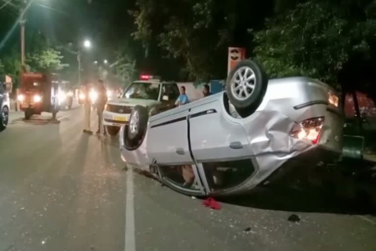 Overturned car in front of minister's bungalow