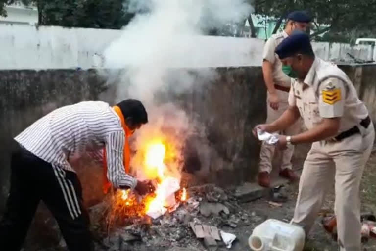 Policemen destroying liquor