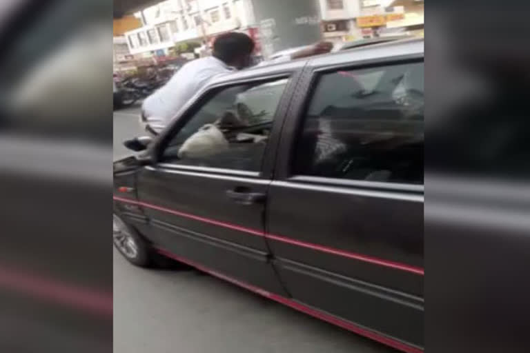 traffic cop on car bonnet