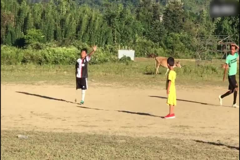 a Class 4 student from Imphal plays football with a single limb