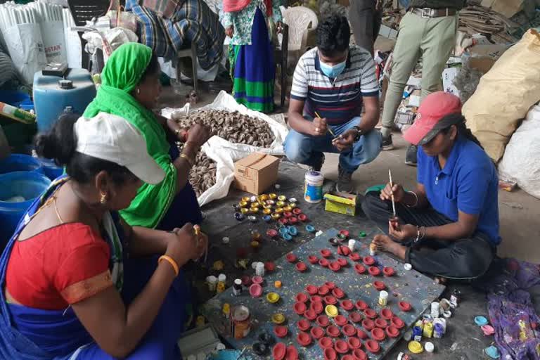 Women making diya of cow dung