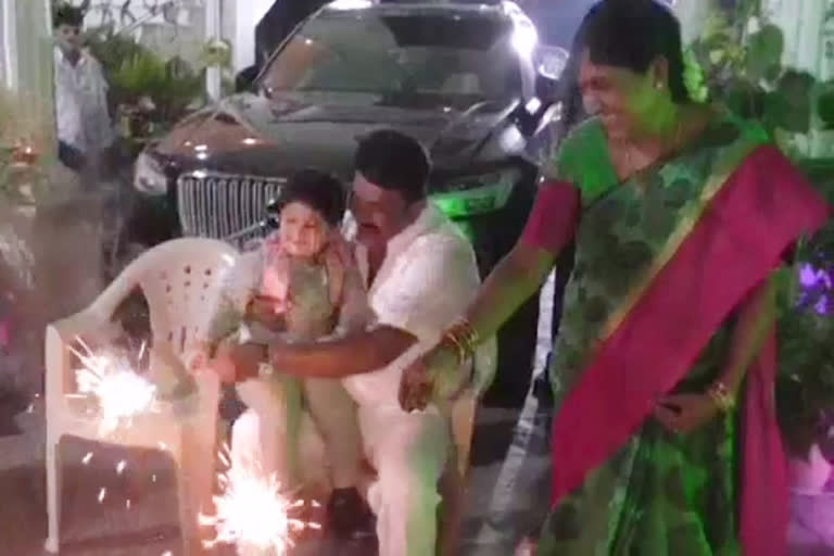minister talasani burn the crackers along with his grandson at marredpally