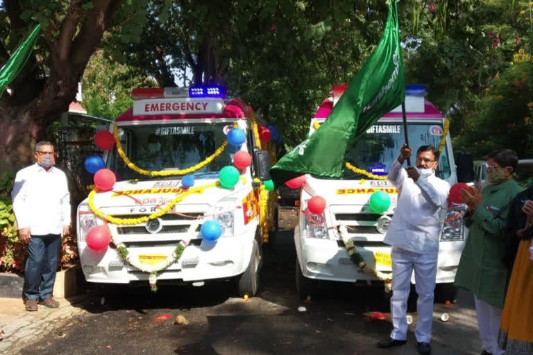 Minister Niranjan handing over the ambulances