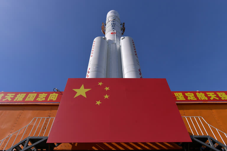 China positions rocket ahead of ambitious lunar mission