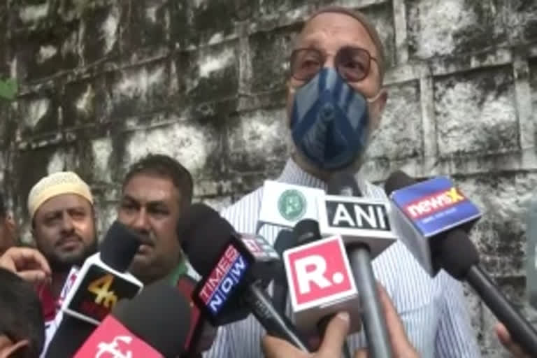 AIMIM chief Asaduddin Owaisi speaking to reporters