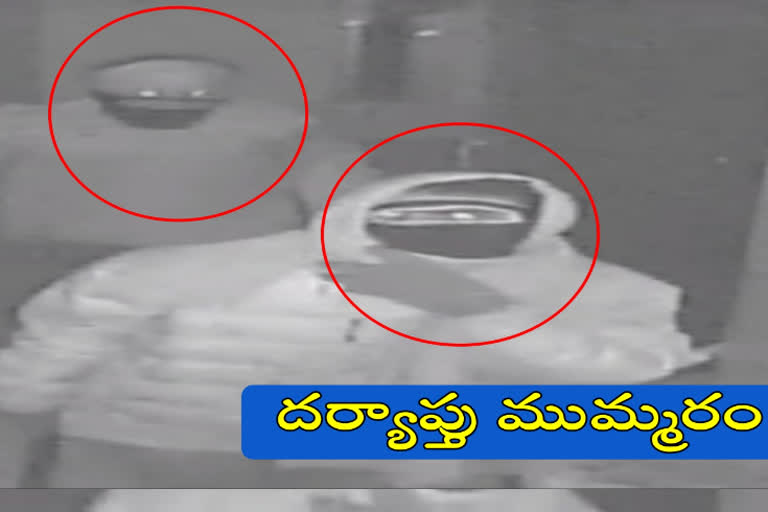 police check the cc footage over sbi robbery