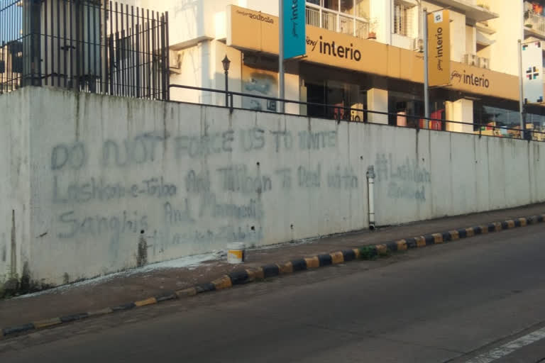 Miscreants graffiti on the wall in support of terrorist groups in Mangalore