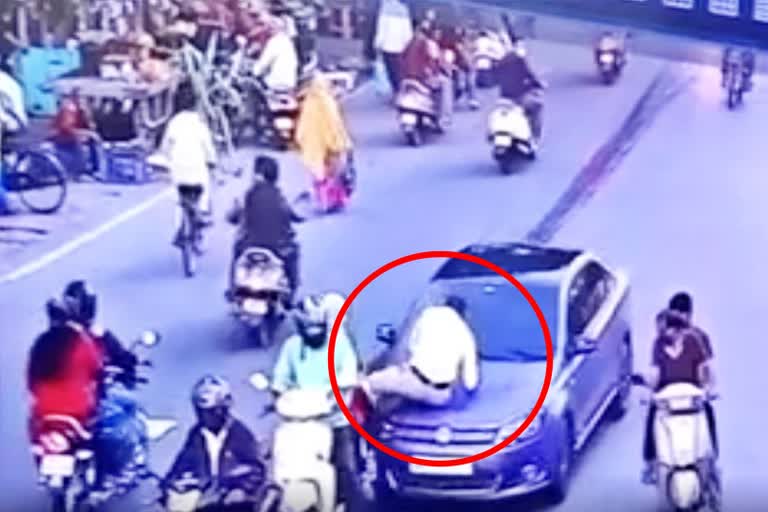 caught-on-camera-traffic-police-dragged-on-car-bonnet-for-half-a-km-in-nagpur