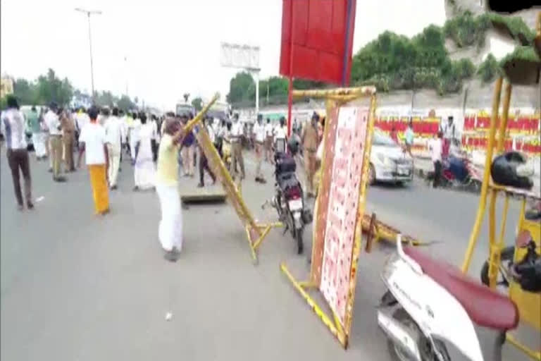 Paattali Makkal Katchi workers pelt stones at a train and block road in Perungalathur after being stopped by police