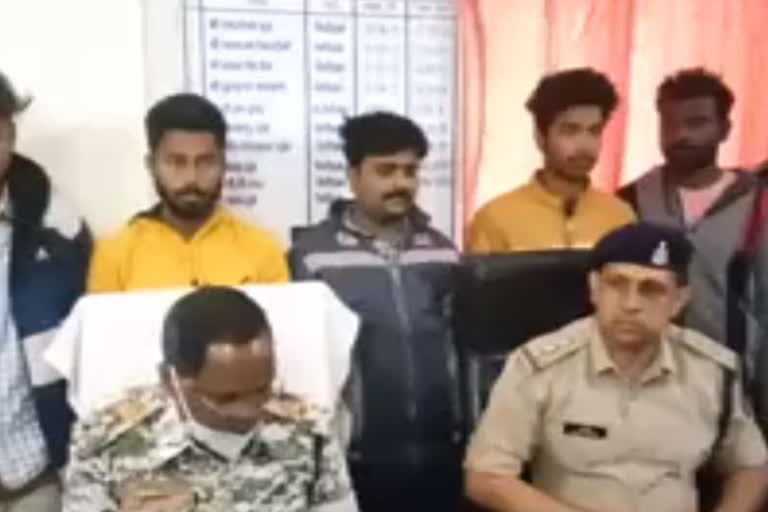 Police officials with arrested gangsters8