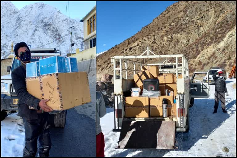 Youth distributing sanitizer amid snowfall in Lahaul Spiti