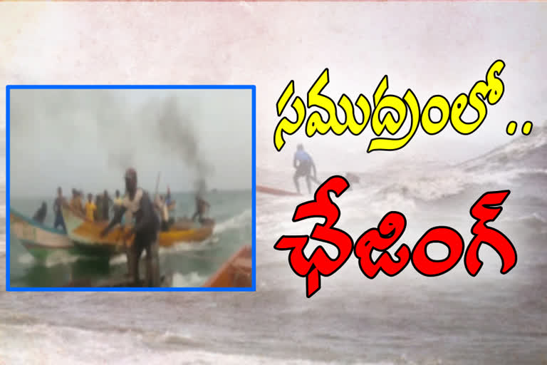 fisher men chasing in sea at chirala