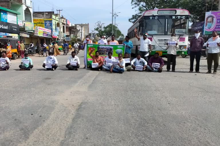 Opposition parties protest in husnabad junction